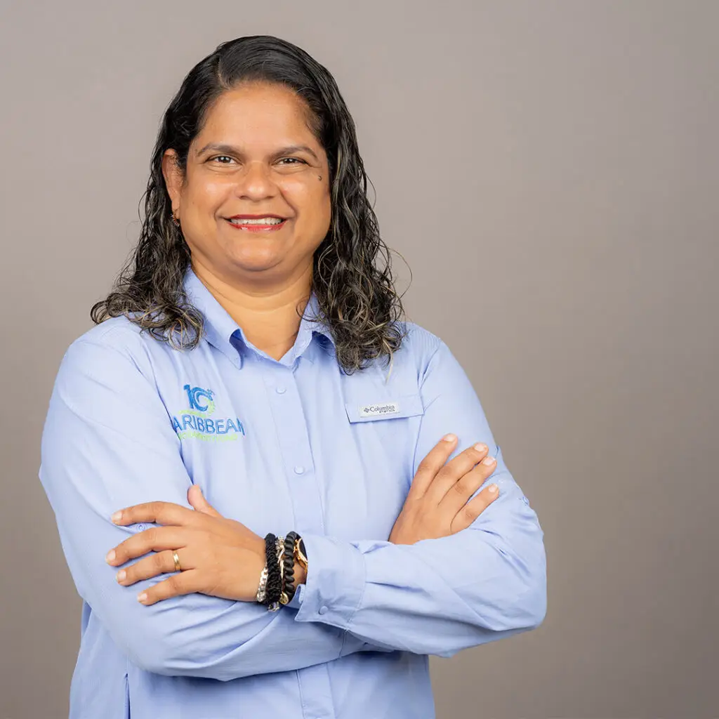 Karen McDonald Gayle, Chief Executive Officer of the CBF poses with hands folded across her chest in a blue button down shirt with the CBF logo on the right pocket area